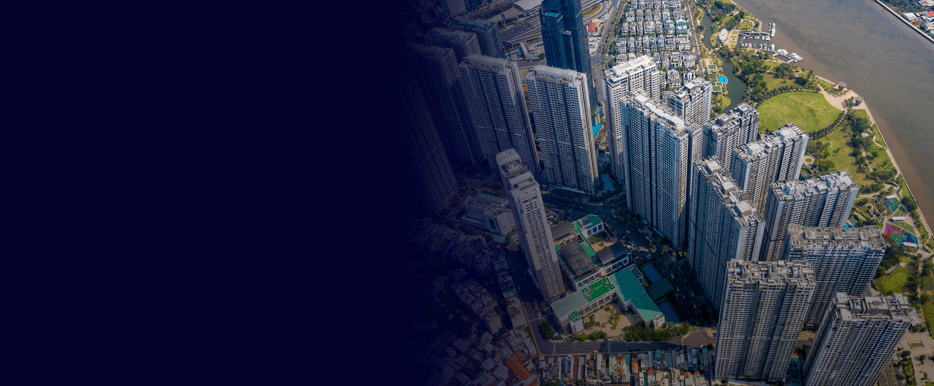 Aerial view of high-rise towers beside the river in Ho Chi Minh City